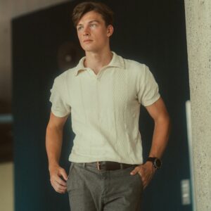 Young Man Posing Wearing White Polo Shirt and Gray Trousers